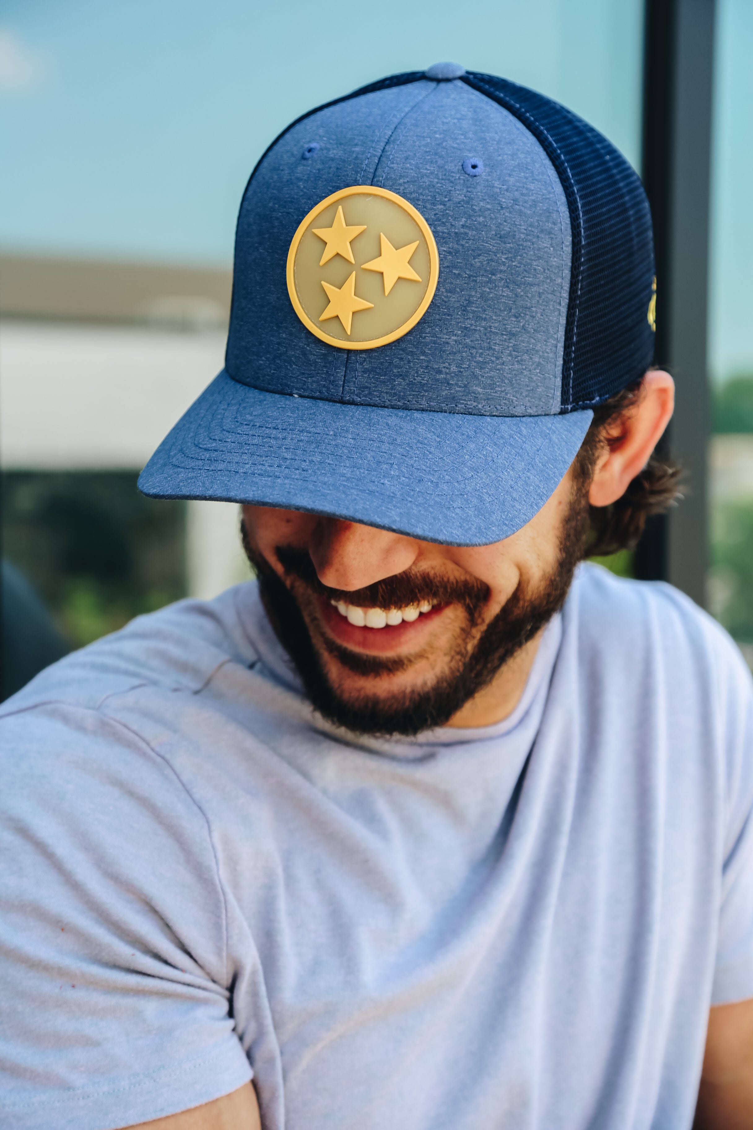 Navy trucker with a gold TriStar sonic weld